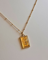 Collier médaille rectangulaire doré cœur & œil – acier inoxydable