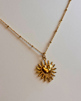 Collier cœur soleil doré – acier inoxydable