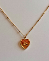 Collier cœur œil doré orange – acier inoxydable